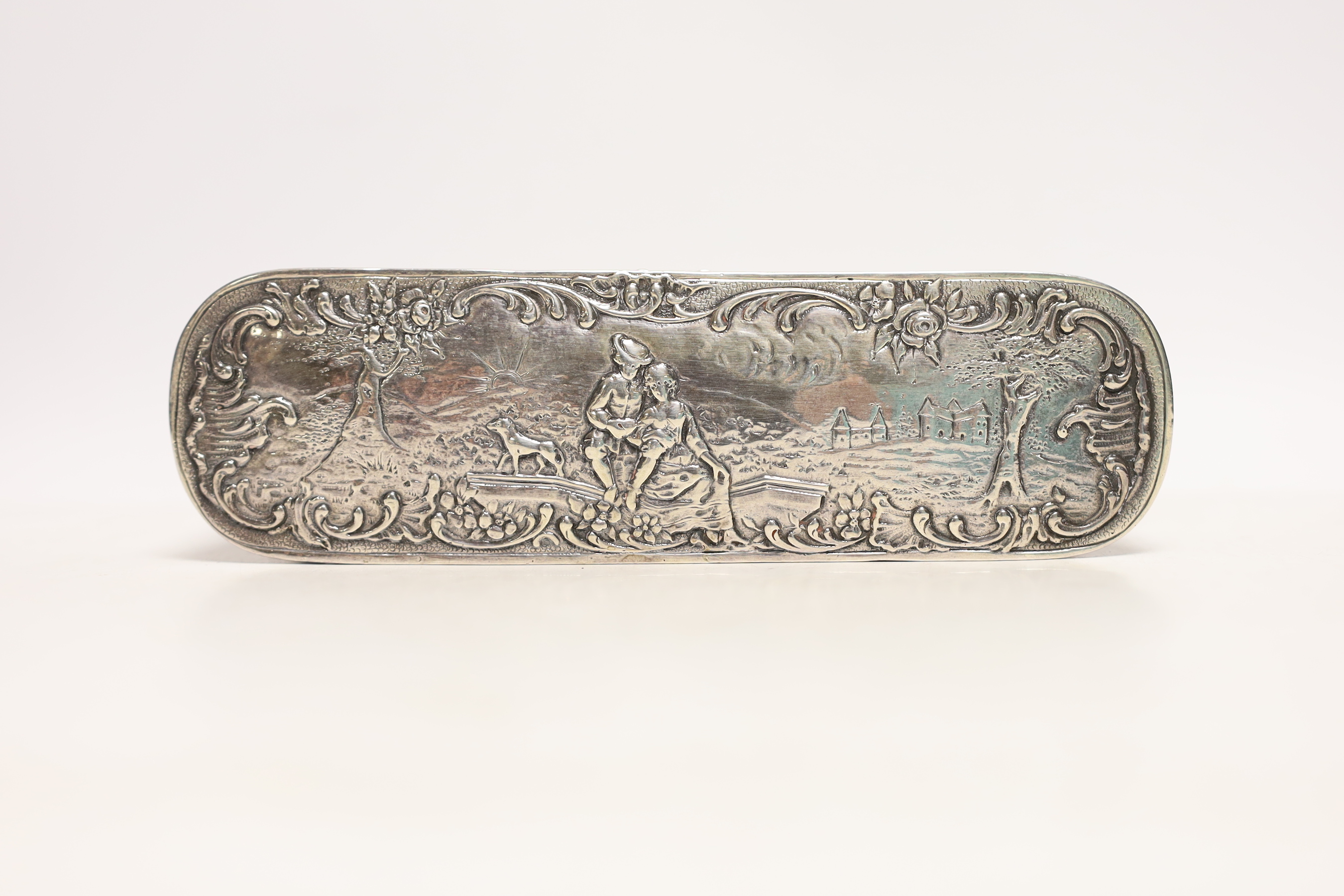 A late 19th/early 20th century Hanau repousse white metal oval box, with hinged cover, 18cm, 7.2oz.